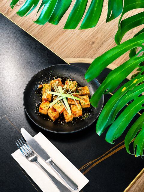Pan-seared sticky chilli tofu sprinkled with parsley